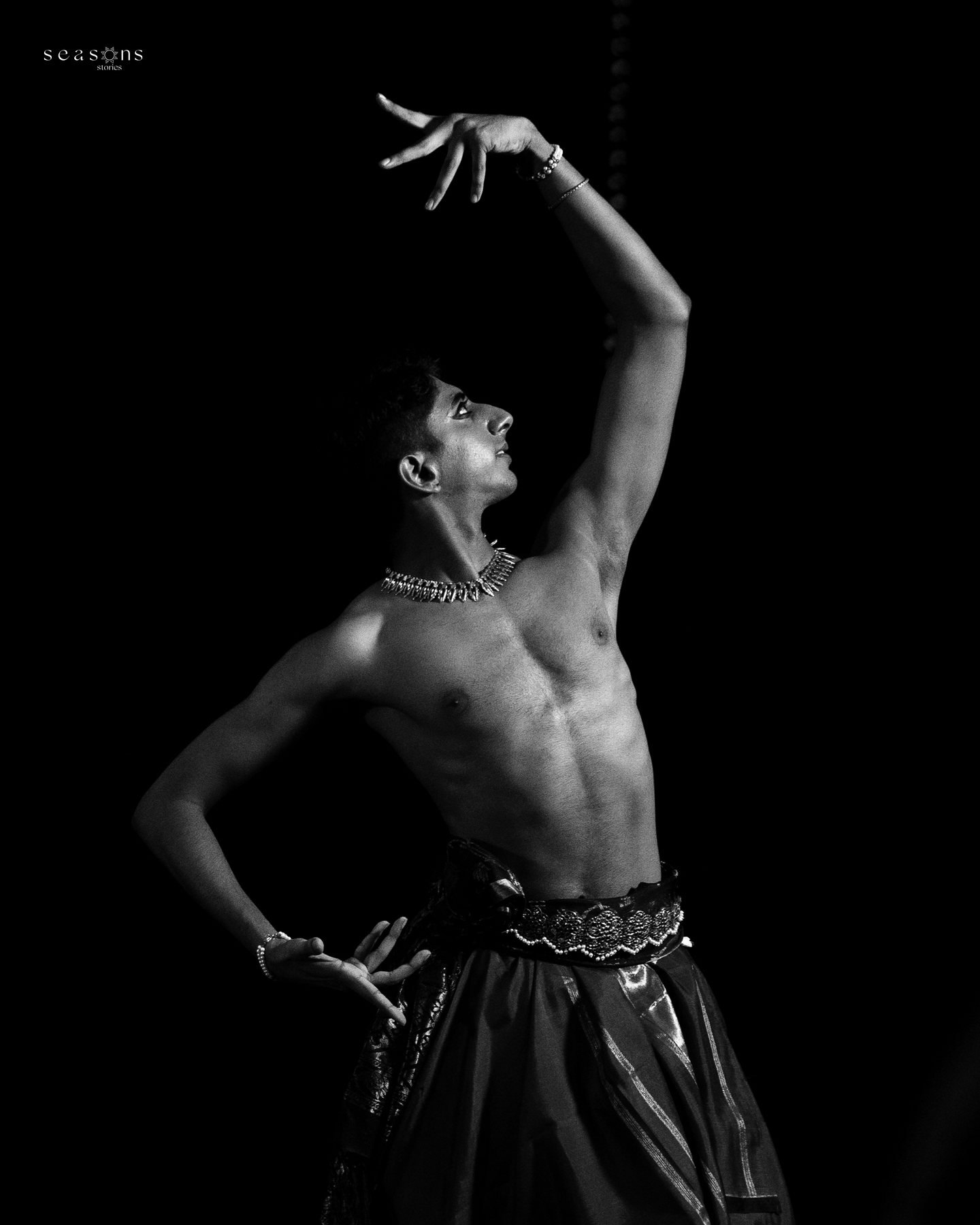Vivek Ramanan, arm raised, black and white
