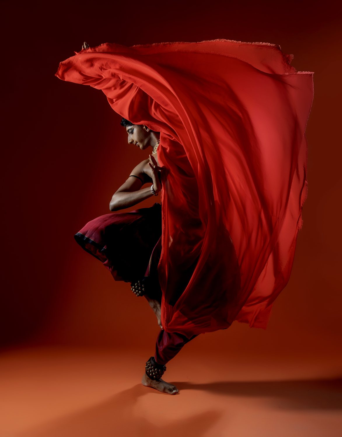 Performance with flowing red fabric